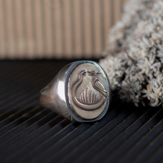 Close-up of the Sunrise at the Reaping ring showing the brass and oxidized silver silver contrast