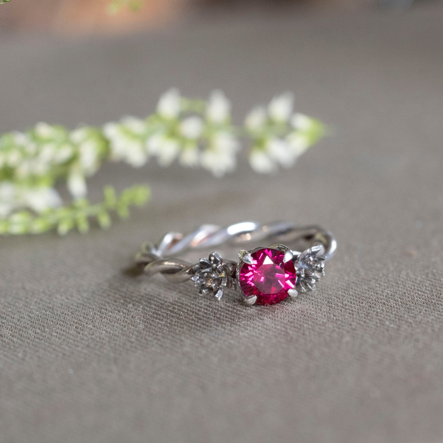 Front view of July Ruby and water lilies ring