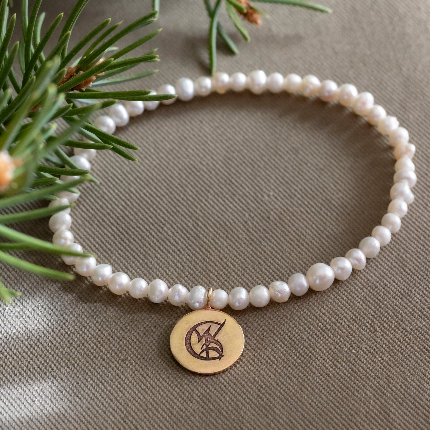 Tessa Gray Pearl Stretchy Bracelet with Brass Wedded Union Rune Medal