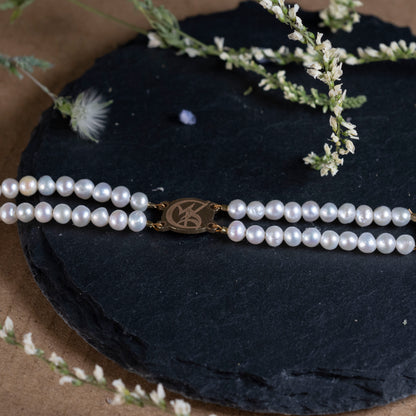 detail of tessa's pearl bracelet